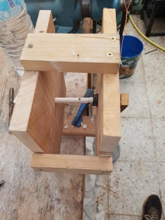 Wooden torsion test rig holding a chalk sample